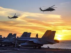 Two MH-60S Seahawk helicopters fly by the USS Carl Vinson in the Pacific Ocean in January 2017. The aircraft carrier deployed to the Western Pacific as part of the U.S. Pacific Fleet-led initiative to extend the command and control functions of the 3rd Fleet into the region. Navy photo by Petty Officer 2nd Class Sean M. Castellano