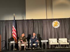 U.S. Air Force Gen. Glen VanHerck (r) speaks with Maj. Gen. Robert Whittle, USA, at the AUSA conference on October 11.
