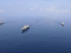 Securing waterways also requires civilians supporting the Navy's activities. Credit: Mass Communication Specialist 3rd Class Catie Coyle.