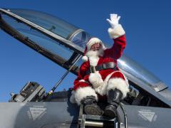U.S. airmen and their families welcome Santa as he arrives in a 169th Fighter Wing F-16 Fighting Falcon fighter jet, at McEntire Joint National Guard Base, South Carolina, December 2019. Swamp Fox children talked to Santa, played games, decorated cookies and made reindeer bells. U.S. Air National Guard photo by Staff Sgt. Megan Floyd, 169th Fighter Wing Public Affairs