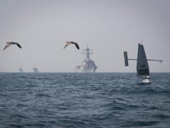 An Explorer unmanned surface vessel operates with the USS Delbert D. Black, HMS Bangor, HMS Chiddingfold and Coast Guard Cutter Robert Goldman during Phantom Scope, a joint United States-United Kingdom exercise in the Persian Gulf. Threats from Russia, China and climate change have increased demand for international cooperation with the U.S. Coast Guard. Credit: Navy Chief Petty Officer Roland Franklin