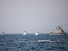 A Devil Ray T-38 unmanned surface vessel, littoral combat ship USS Sioux City and U.S. Coast Guard cutters USCGC Baranof and USCGC Robert Goldman and coastal patrol ship USS Thunderbolt sail in the Arabian Gulf, June 26, 2022. U.S. naval forces regularly operate across the Middle East region to help ensure security and stability. Credit: U.S. Army photo by Spc. Ian Miller