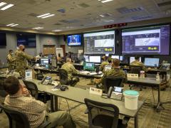 Army Col. Christopher Caldwell, the J3 operations director assigned to Joint Task Force Civil Support (JTF-CS), details the capabilities of the JTF-CS common operating picture to Commanding General Maj. Gen. Jeff Van and JTF-CS staff during a Joint All-Domain Command & Control System demonstration.  U.S. Navy photo by Mass Communication Specialist 2nd Class Michael H. Lehman/Released