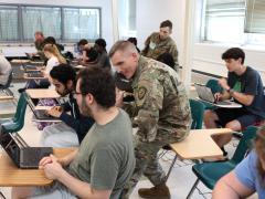 Soldiers from the 780th Military Intelligence Brigade (Cyber) engaged students from Arundel High School in Gambrils, Md. to encourage their interest in STEM. Photo by Steven Stover. 