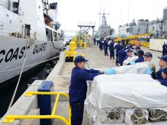 USCG and CBP partner to interdict 3,500 pounds of marijuana and over 30 pounds of methamphetamine from a boat in international waters 170 miles southwest of San Diego. U.S. Coast Guard photo by Petty Officer 3rd Class Connie Terrell. 2014.