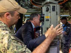 Australian Deputy Prime Minister Richard Marles looks through the periscope of the USS Asheville while moored in Western Australia in March. Credit: Australian Department of Defense