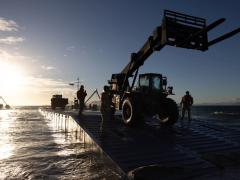 U.S. Army soldiers land equipment on the beach from a floating causeway in Bowen, North Queensland, Australia on July 31 during Exercise Talisman Sabre. The effort was part of the Joint Logistics Over the Shore activities that enables the movement of equipment, machinery and vehicles to support theater military operations. The Army’s I Corps created dispersed command and control nodes to connect decision making and data around the globe for the exercise.