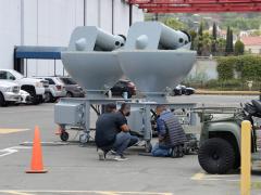 NAVWAR engineers perform checks on fleet-bound antennae. Photo credit: Rick Naystatt, U.S. Navy.