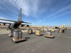 U.S. Air Force loadmasters prepare humanitarian aid destined for airdrop over Gaza by a U.S. Air Forces Central HC-130J Combat King II at an undisclosed location in the U.S. Central Command area of responsibility, March 14, the 10th such airdrop since March 2. U.S. Air Force photo by 1st Lt. Kaitlyn Lawton 