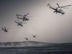 Army AH-64 Apaches fly in formation with Hungarian Mi-24 Hinds during Saber Guardian in Varpalota, Hungary, June 9, 2021. The Army is seeking foreign military sales approval for the Common Infrared Countermeasures system, which is supplied by Northrop Grumman and fielded onto Apaches and other Army helicopters. Photo by Army Maj. Robert Fellingham