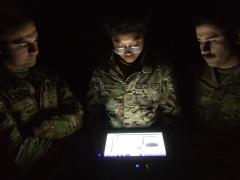 436th Civil Engineer Squadron Explosive Ordnance Disposal technicians (l-r) Senior Airman Kevin Sinning, Airman 1st Class Ariana Nalica and Senior Airman James Verrelli, look at the X-ray of an improvised explosive device taken during a training session at Dover Air Force Base, Delaware, in October 2023. A portable X-ray device wirelessly sends the image to a display tablet for viewing and analysis. U.S. Air Force photo by Roland Balik