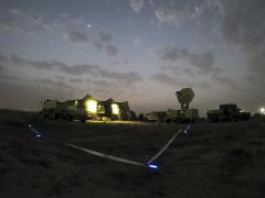 Soldiers work to establish network connectivity in M1087 expandable van shelters during a training exercise at Camp Arifjan, Kuwait, February 4, 2022. Recent network modernization efforts provide greater cybersecurity and improve network speed, reliability and resiliency at Camp Arifjan and at Army Central headquarters at Shaw Air Force Base, South Carolina. Credit: Army Sgt. 1st Class Mary Katzenberger