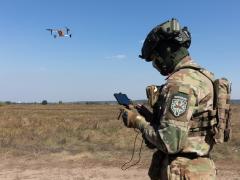 A drone operator launches a quadrocopter to search for the wounded on the battlefield in the Kyiv region. Credit: Drop of Light/ Shutterstock