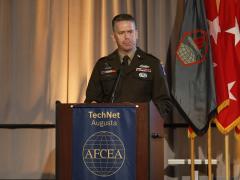 Brig. Gen. John Cogbill speaks at AFCEA's TechNet Augusta 2024 in Augusta, Georgia.