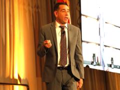 Army CIO Leonel Garciga addresses the audience at TechNet Augusta 2024.