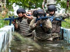 Army Reserve soldiers on Alpha Team of the 335th Signal Command (Theater) 2024 Best Warrior Competition transport a mock injured soldier through a water obstacle during training at Joint Base McGuire–Dix–Lakehurst, New Jersey, May 14, 2024. Dedicated Internet of Things technologies can offer the military advantages at the edge. Credit: U.S. Army Reserve photo by Sgt. Reginald Harvey