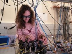 Esther Baumann, research scientist, National Institute of Standards and Technology, works on part of the advanced laser-based technology. Credit: R. Jacobson/NIST
