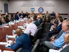 Gen. Glen VanHerck, commander in 2023 of the North American Aerospace Defense Command (NORAD) and U.S. Northern Command, spoke with members of the Cybersecurity and Infrastructure Security Agency, or CISA, including Deputy Director of CISA Nitin Natarajan, as well as industry leaders at the NORAD and the command headquarters on Peterson Space Force Base, Colorado, August 22, 2023. CISA has worked for several years to strengthen its partnerships. Credit: Department of Defense photo by Joshua Armstrong