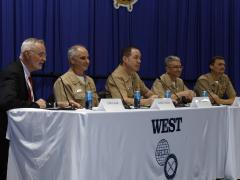 Rear Adm. Kavon “Hak” Hakimzadeh (far right), commander for Carrier Strike Group 2, speaks on a panel at WEST 2025 in San Diego. Credit: Michael Carpenter