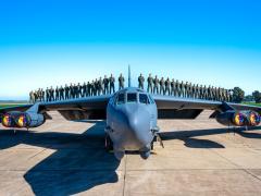 Pilots stand on top of the Air Force’s B-52H aircraft in an updated photo. The service’s Air Force Life Cycle Management Center (LCMC) is responsible for the B-52H Commercial Engine Replacement Program to keep the aircraft in service. The LCMC’s Program Executive Officer for Command, Control, Communications, Intelligence, and Networks provides the underpinning of networks and cyber to support the service’s operations. Credit: U.S. Air Force