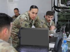 U.S. Army Sgt. 1st Class Maria Devers (c), assigned to Headquarters and Headquarters Battalion, 4th Infantry Division, and U.S. Army Spc. Jaeger Falco, assigned to the Utah National Guard’s 4th Infantry Division Main Command Post Operational Detachment, both Ground Movement Target Indicator (GMTI) operators, coordinate a simulated ground attack during a multi-domain and multinational operations command post exercise in Boleslawiec, Poland, in June 2023. Credit: U.S. Army photo by Sgt. 1st Class Bridget Vian