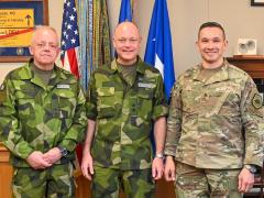 U.S. Air Force Lt. Gen. Thomas Hensley, commander, 16th Air Force, Air Forces Cyber and Joint Force Headquarters (Air Force), Joint Base San Antonio-Lackland, Texas, stands with Swedish Navy (Marines) Maj. Gen. Rikard Askstedt (l), the Swedish Embassy Defense attaché, and Swedish Armed Forces Maj. Gen. Johan Pekkari (c), during a February 2024 visit at Joint Base San Antonio-Lackland. 16th Air Force is working to harmonize defensive cyber. Credit: U.S. Air Force photo by Deirdre McNamara