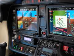 A modern aircraft cockpit control panel with navigation system displays a flight route. Credit: alvaro-stock.adobe.com