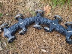 The Slithering Centipede-like Undulatory Terradynamically Tactical Legged Explorer (SCUTTLE) robot being brought to market by Ground Control Robotics Inc., mimics the movement of a centipede. Its low profile makes it capable of maneuvering under vegetative canopies, or through pipes, crawl spaces and debris. Credit: Ground Control Robotics/Erik Teder