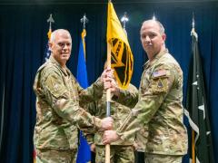Col. Neil Barnas (r), USSF, assumes command of Systems Delta 831 (SYD 831) on October 2, at Los Angeles Air Force Base, as Lt. Gen. Phil Garrant, USSF, Space Systems Commander presides over the ceremony.