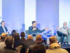Maj. Gen. Bradley Pyburn, USAF (Ret.) (l), Lt. Gen. Robert Skinner, USAF (Ret.) (c), and Lt. Gen. Chris "Wedge" Weggeman, USAF (Ret.), discuss cyber warfare at the Rocky Mountain Cyberspace Symposium on February 4, 2026. Photo Credit: Zach Watkins, LVTD Digital