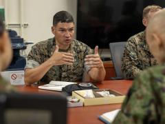 U.S. Marine Corps Col. Joshua Mayoral, commanding officer of III Marine Expeditionary Force Information Group, delivers a brief during Resolute Dragon 25 at Camp Courtney, Okinawa, Japan, September 16, 2025. Two government programs have opened for cyber and information technology professionals to grow their abilities in different organizations such as the U.S. Marine Corps Forces Cyberspace Command. U.S. Marine Corps photo by Cpl. Juan Maldonado