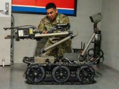 Master Sgt. Rolando Silguero, noncommissioned officer in charge at the Chemical Defense Training Facility, prepares a man transportable robotic system to perform site exploration in February at Fort Leonard Wood. Credit: U.S. Army photo by Melissa Buckley