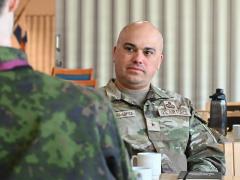 Brig. Gen. Joed Carbonell-López, commander of the 175th Wing of the Maryland Air National Guard, discusses exercise objectives and priorities with a Finnish project officer during his visit to NATO Exercise Locked Shields 26 in central Finland on April 21, 2026. Credit: U.S. Air National Guard photo by Staff Sgt. Laura Virtue