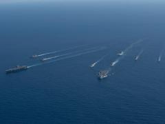 The U. K. Royal Navy HMS Prince of Wales Carrier Strike Group operates with the U.S. Navy George Washington Carrier Strike Group in the Timor Sea, as part of Talisman Sabre, July 2025. Senior U.S. military leaders call for the understanding and widespread use of Allied Communications Publications 240, standards of which underpin effective operations, data sharing and network connections, among allies. U.S. Navy photo by Mass Communication Specialist 2nd Class Tyler Crowley