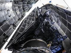 A Lockheed Martin GPS III satellite is encapsulated into the fairings of a SpaceX Falcon 9 Rocket in preparation for the National Security Space Launch GPS III-8 mission, Cape Canaveral Space Force Station, Florida, April 15, 2026. Credit: Maj. Brittany Curry