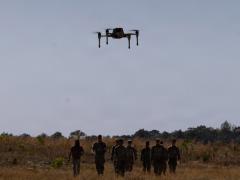 A bumblebee drone flies in front of a group of 82nd Airborne Division Soldiers at Fort Bragg, North Carolina, in April. Credit: U.S. Army Photo by Staff Sgt. Cory Reese