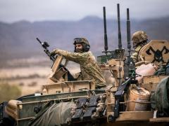 Spc. Hayzin Zappanti, an armor crewmember assigned to Bravo Company, 1st Battalion, 66th Armor Regiment, 3rd Armored Brigade Combat Team, 4th Infantry Division, provides security during Ivy Mass on Fort Carson, Colorado, May 5, 2026. Ivy Mass validated large-scale combat operations while integrating Next Generation Command and Control capabilities to enhance situational awareness, data sharing, and decision-making across the formation. Credit: U.S. Army photo by Spc. Thomas Nguyen