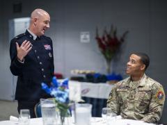 Space Force Col. Andrew Menschner, deputy commander of Space Systems Command, and Air Force 1st Lt. Dorian Maynard, officer in charge of the 61st contracting flight, Space Base Delta 3, speak during a STEM scholarship luncheon at Los Angeles Air Force Base in El Segundo, California, on Sept. 22, 2026. Credit: Van Ha