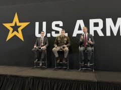 Joseph Welch, portfolio acquisition executive (PAE) for C2 and Counter C2 in the U.S. Army (l), speaks at the 2026 Association of the U.S. Army’s (AUSA) Annual Meeting and Exposition.