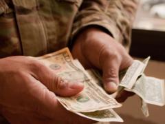 Money comes in many forms. Are paper bills or checks the safest way to pay? (U.S. Army photo by Kristen Wong)