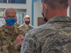 Lt. Gen. Ronald Place, USA, director of the Defense Health Agency (DHA), speaks with a U.S. Airman assigned to the 4th Medical Group at Seymour Johnson Air Force Base, North Carolina, in August. The director is leading the DHA's efforts to improve the care of warfighters, including through the use of advanced technology, where appropriate. Credit: U.S. Air Force photo by Senior Airman Kylee Gardner