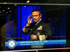 Adm. Harry B. Harris Jr., USN, uses Google Glass as a teleprompter at WEST 2014.