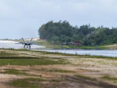A U.S. Air Force F-22 Raptor assigned to the 525th Fighter Squadron completes agile combat employment (ACE) maneuvers during Operation Pacific Iron 2021 at Northwest Field, Guam, in July. The austere conditions of the former World War II airfield offered ideal conditions for airmen to train in ACE. Credit: Air Force photo by Senior Airman Alexandra Minor.
