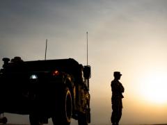 A U.S. Army soldier stands outside a Humvee before the start of the Dasman Shield live fire exercise in Kuwait in February. During the exercise, the military looked at the beginnings of all domain operations, including air-to-ground command control, as well as partner interoperability with Kuwaiti forces.  U.S. Air Force photo by Senior Airman Kevin Tanenbaum