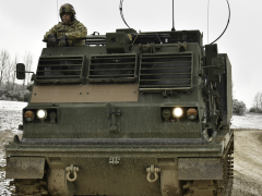 A U.S. Army M270 Multiple Launch Rocket System sits during a demonstration at the Grafenwoehr Training Area in Germany in February. The Army Futures Command is creating a software factory to train warfighters to code on the spot. Credit: U.S. Army photo by Spc. Denice Lopez