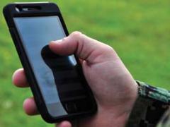 A U.S. Marine experiments with Lighthouse software on a mobile device.