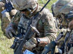 1st Lt. Zachary Johnson, USA (l), uses a Nett Warrior end-user device during air assault training as part of Exercise Saber Junction 2018 at the Grafenwoehr Training Area, Germany. 1st Lt. Johnson is assigned to the 1st Battalion, 503rd Infantry Regiment, 173rd Airborne Brigade, one of several units evaluating the Integrated Tactical Network (ITN) during operational exercises to help inform design decisions for future Infantry, Stryker and Armor formations.  U.S. Army photo/Spc. Rolyn Kropf, USA