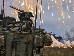 Soldiers attack simulated enemy combatants during a training exercise at the Hohenfels Training Area in Germany. To meet the Army’s vision of multidomain battle, the service will need to build a battle-hardened network. Army photo by Pvt. Randy Wren