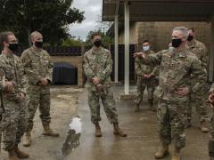 Lt. Gen. Timothy Haugh, USAF (right c), commander, 16th Air Force (Air Forces Cyber), and Chief M. Sgt. Kenneth Bruce, USAF (r), command chief, 16th Air Force, discuss the 2nd Combat Weather Systems Squadron efforts during a visit at Hurlburt Field, Florida, in April. The command, which spent the last two years integrating information warfare capabilities including weather intelligence, sees zero trust as a core technology. Credit: USAF photo by Senior Airman Robyn Hunsinger