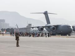 Evacuees load on to a United Arab Emirates (UAE) Boeing C-17 Globemaster III during the evacuation at Hamid Karzai International Airport, Kabul, Afghanistan, August 2021. The office of the Joint Staff J-6 initiated Project Orsus to overcome data challenges associated with the evacuation and say that project will likely impact the future of joint all-domain command and control. U.S. Marine Corps photo by Sgt. Samuel Ruiz